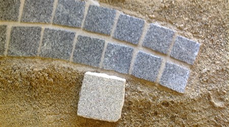 Synthetic resin film after jointing on light-coloured granite pavers